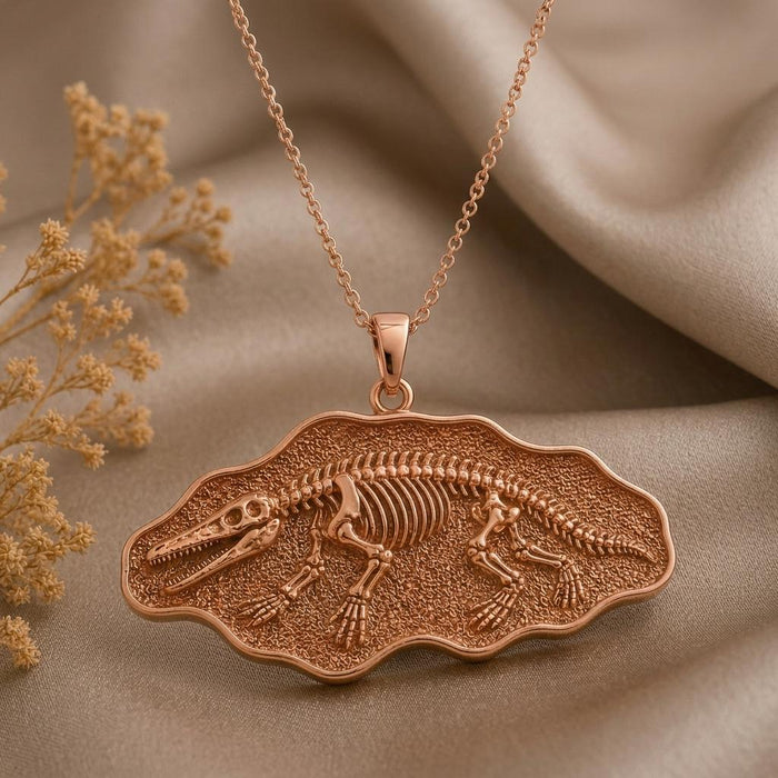 Close view of a Rose Gold Plated Ambulocetus Fossil Pendant with a textured fossil-style frame