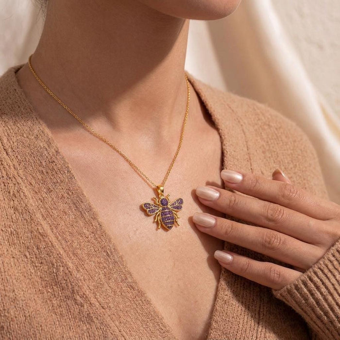 Gold Plated Silver Amethyst Druzy Bee Necklace worn with a brown knit cardigan