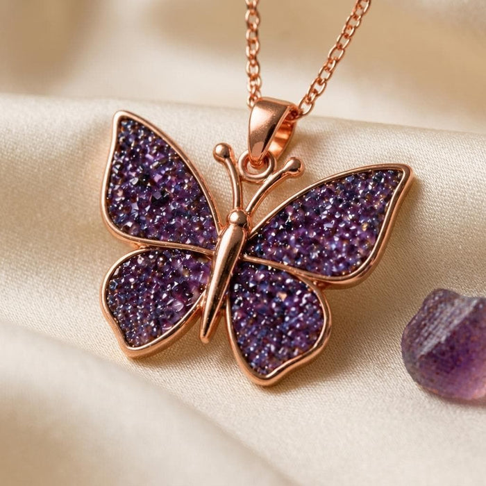 Rose Gold Plated butterfly pendant close-up with rounded antennae and four textured purple wing panels