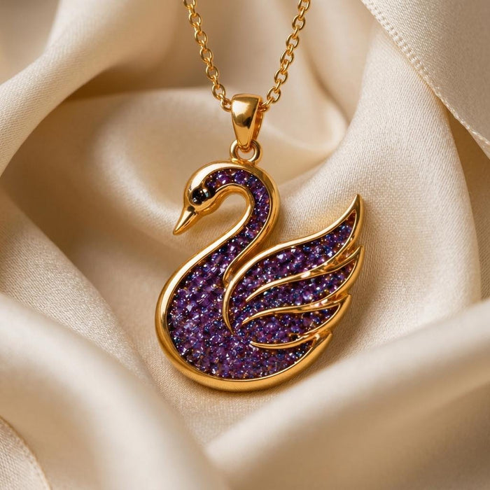 Gold Plated Silver Amethyst Druzy Swan Pendant Necklace on champagne satin with a textured purple swan body