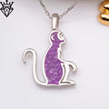 Front view of a seated monkey pendant with a purple center on a white background