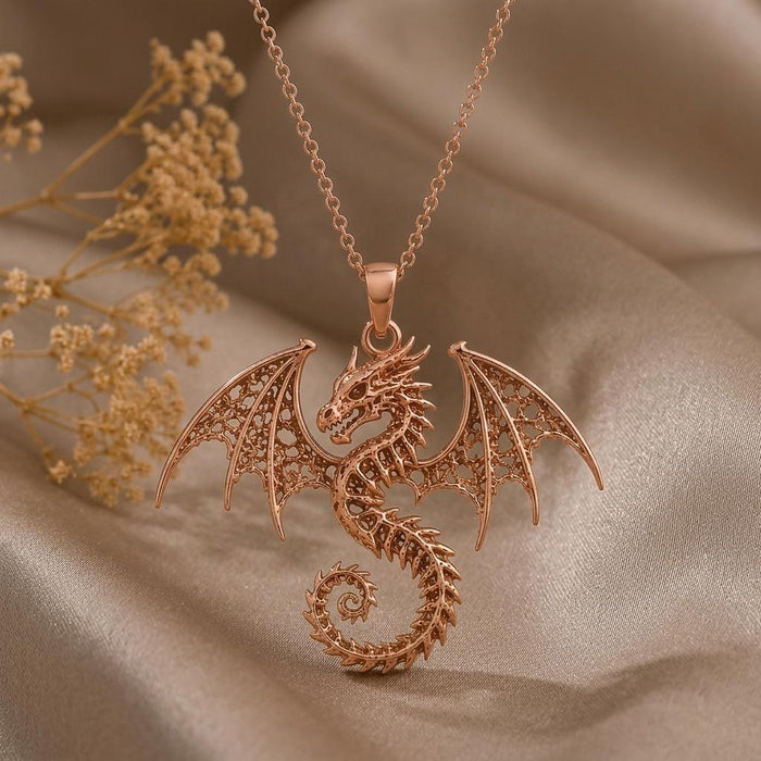 Rose-toned Ancient Dragon Fossil necklace on draped neutral satin with dried flowers