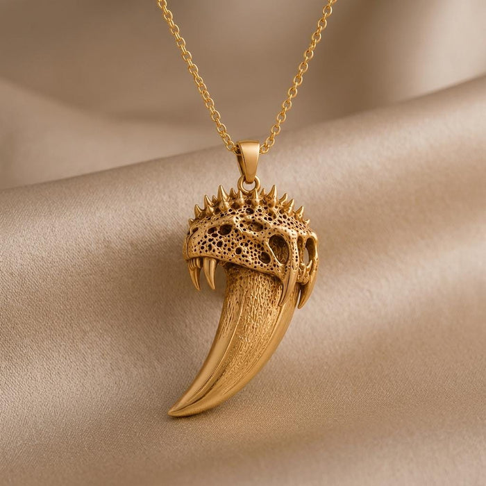 Gold Plated Silver Ancient Saber Tooth Pendant with textured curved tooth on champagne satin