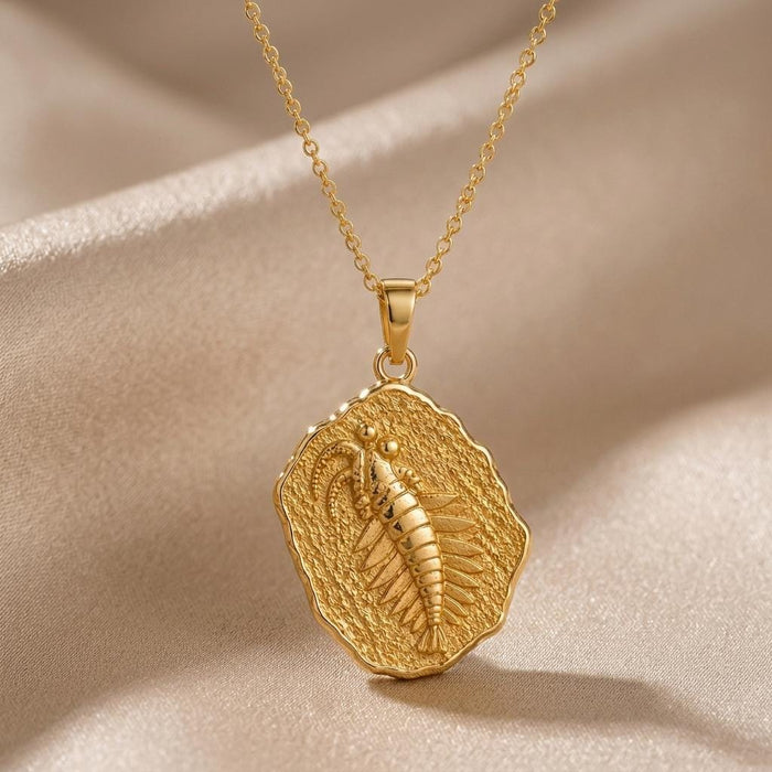 Gold Plated Silver Anomalocaris fossil relief pendant necklace on champagne satin