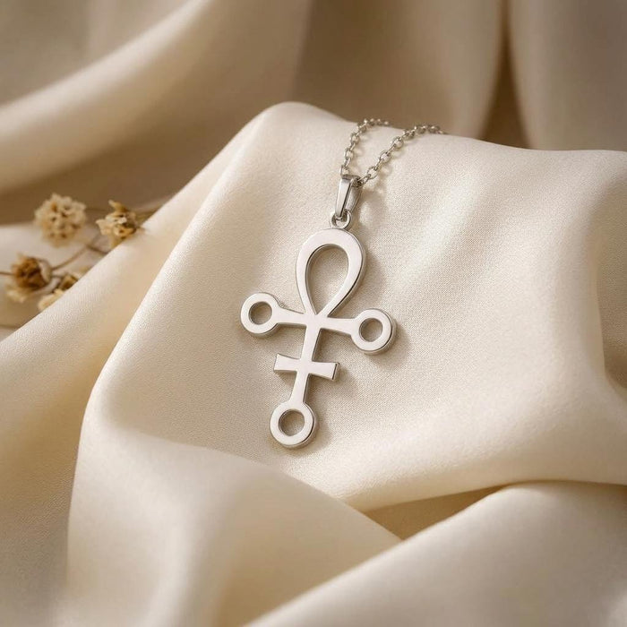 Polished Anubis symbol pendant necklace displayed on ivory satin