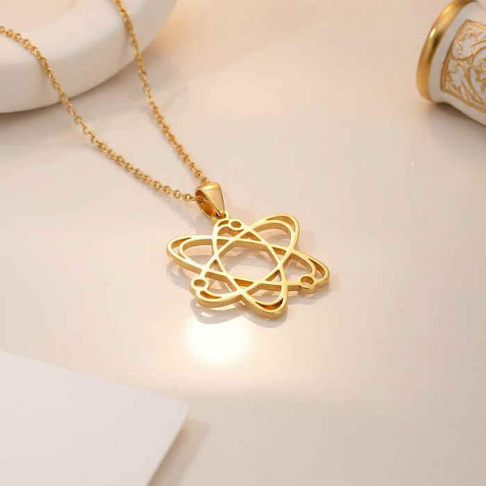 Close-up of a Gold Plated Silver Atom Necklace showing three intersecting orbit lines and an open center
