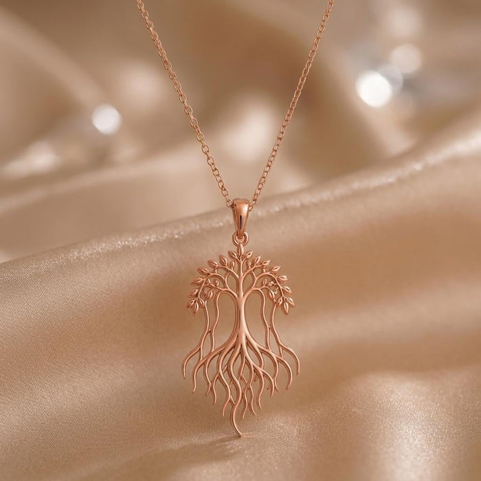 Rose Gold Plated Banyan Flow Necklace with an openwork tree canopy and long flowing roots on satin