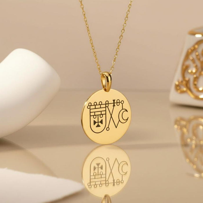 Gold Plated Silver Bathin Sigil Necklace on a reflective display surface