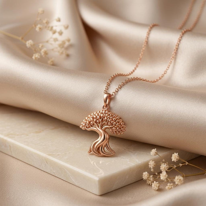 Rose Gold Plated Ficus Flow Pendant with a rounded tree canopy on a pale stone block