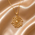 Gold Plated Silver Spiral Galaxy Pendant Necklace on champagne satin