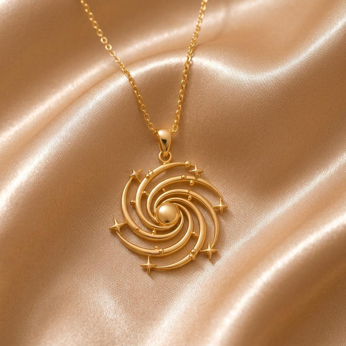 Gold Plated Silver Spiral Galaxy Pendant Necklace on champagne satin