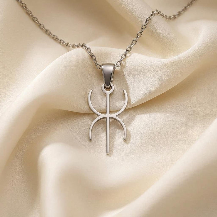 Close-up of the Silver Duality Symbol pendant on ivory satin