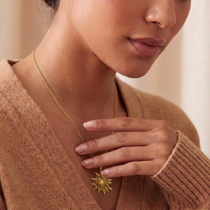 Close-up of Gold Plated Silver Betelgeuse star necklace worn at the neckline