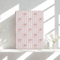 Blush pink Kindle case with bow pattern, built-in hand strap and back magnets