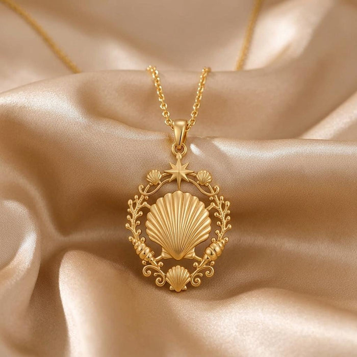 Gold Plated Silver Shell Halo Pendant Necklace with a ridged shell and star detail on champagne satin