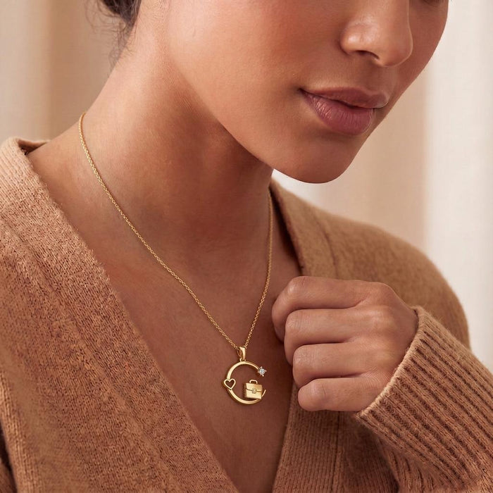 Model wearing an incorrect Gold Plated Silver circular briefcase-and-heart pendant necklace