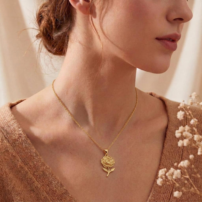 Gold Plated Silver Camellia Flower Necklace worn at the collarbone with a neutral knit top