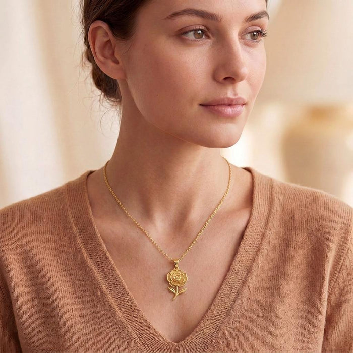 Model wearing a Gold Plated Silver Camellia Flower Necklace with a V-neck knit top