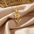 Gold Plated Silver Canna Flower Pendant Necklace with a sculpted bloom and two leaves on champagne satin
