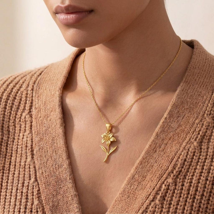Gold Plated Silver Canna Flower Pendant Necklace worn with a ribbed cardigan