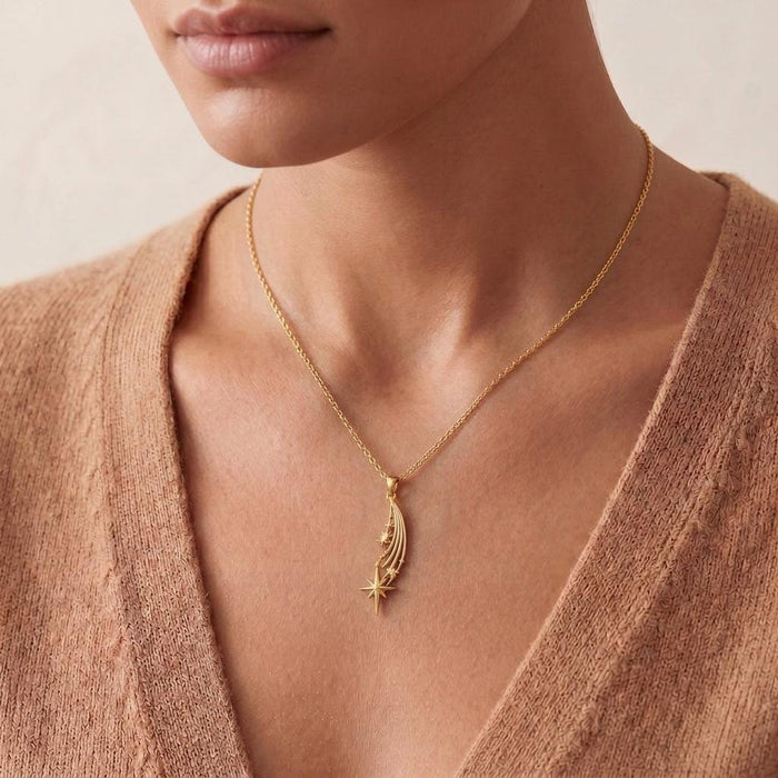 Gold Plated Silver Falling Star Pendant Necklace worn with a V-neck knit top
