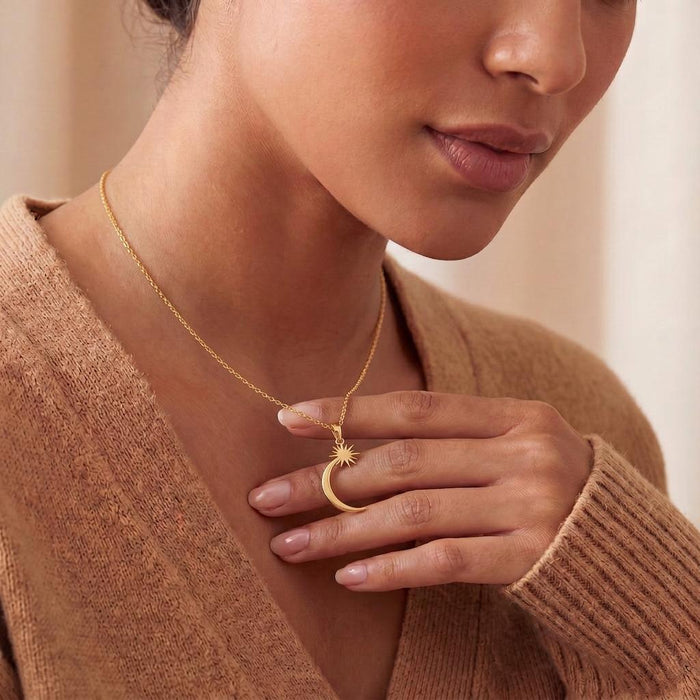 Close view of a model wearing the Gold Plated Silver Celestial Crescent Star Necklace