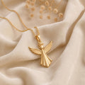 Gold Plated Silver angel pendant necklace with feathered wings and a flared robe on ivory satin