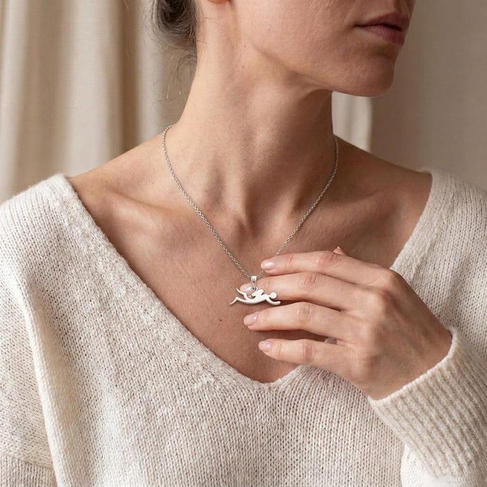 Diver Silver Necklace worn with a cream V-neck sweater