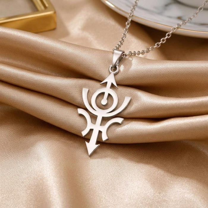 Cosmic Nibiru pendant necklace displayed on champagne satin