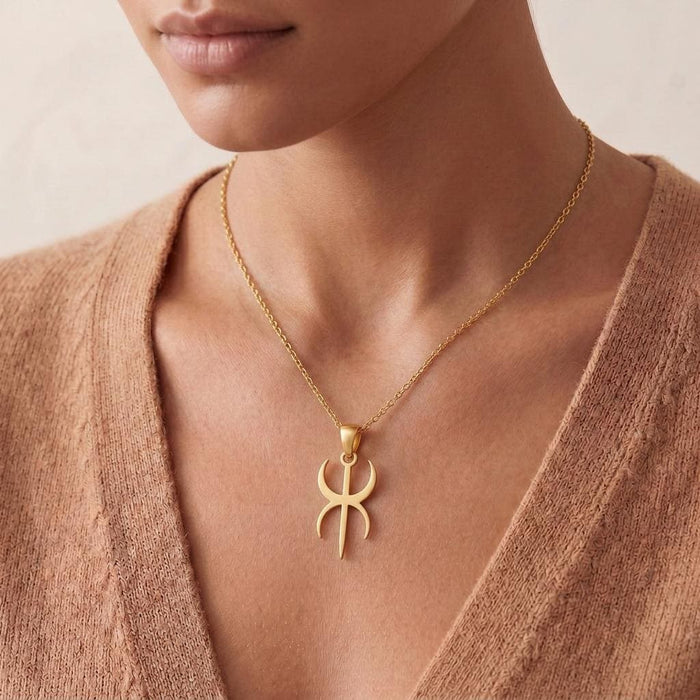 Front view of a Gold Plated Silver Duality Symbol Necklace worn with a V-neck neutral cardigan