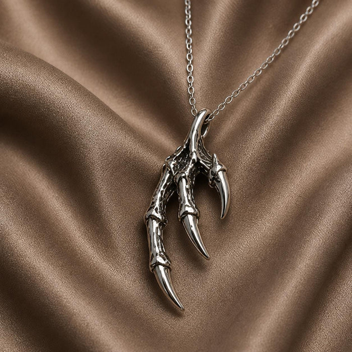 Silver Dragon Claw Pendant Necklace with three articulated talons on bronze satin