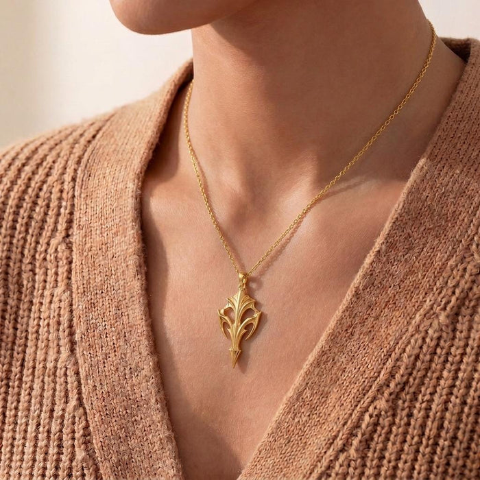 Gold Plated Silver Eclipse Armor Pendant necklace worn with a textured knit cardigan