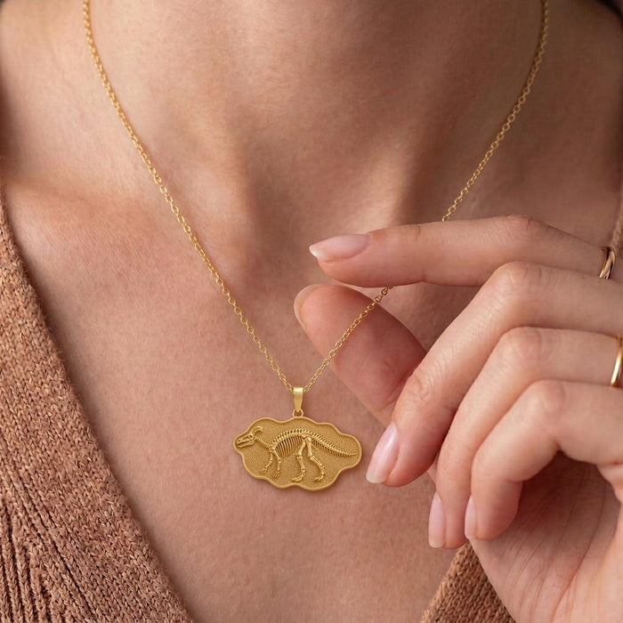 Gold Plated Silver Edmontosaurus fossil plaque necklace worn with a knit top