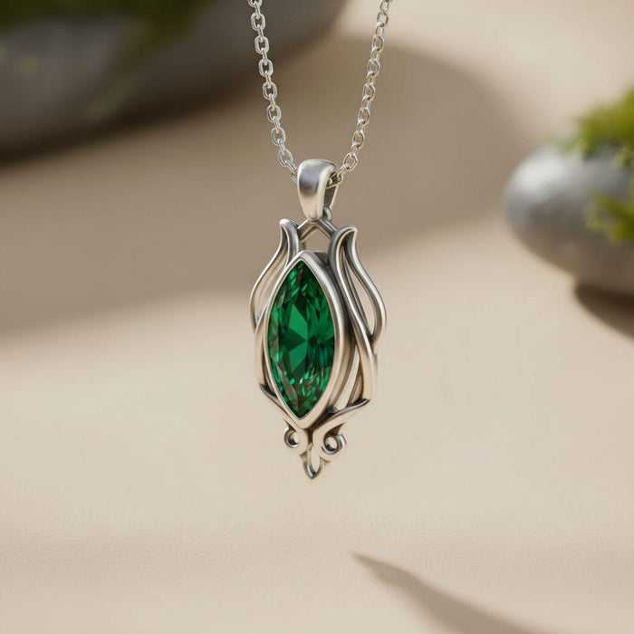 Silver Elven Forest Birthstone Necklace with a green marquise-shaped stone and teardrop-shaped lower point