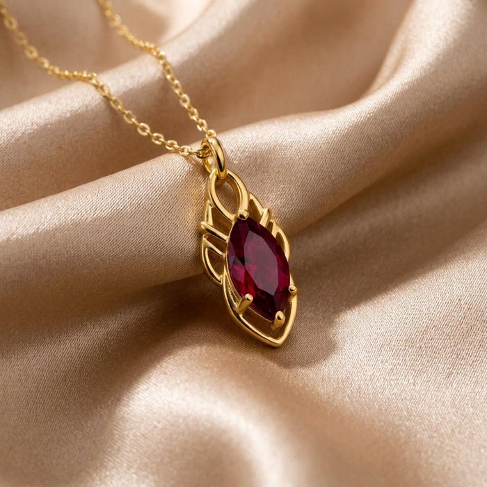 Elven Ruby Necklace with ruby-red marquise center on champagne satin