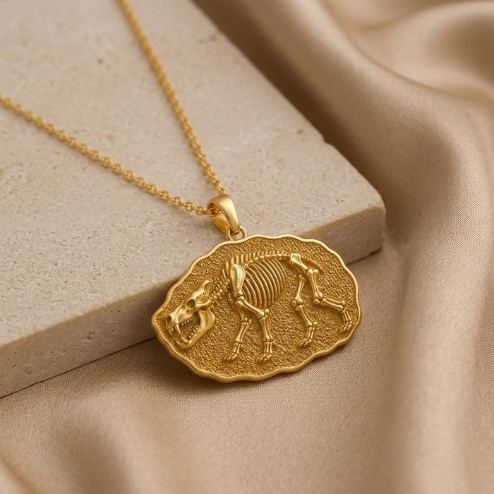 Gold Plated Silver Entelodon Fossil Pendant Necklace on beige stone and satin