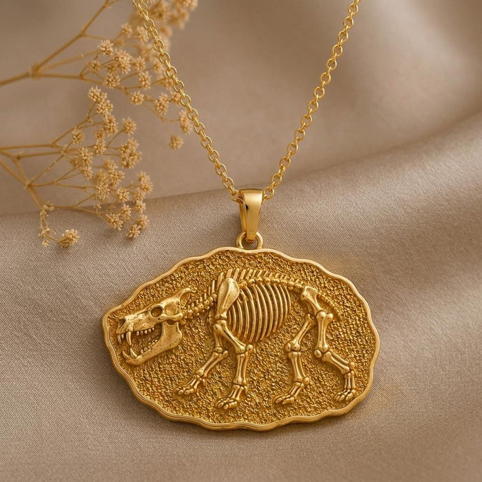 Close view of the raised Entelodon skeleton relief on a Gold Plated Silver fossil-style medallion