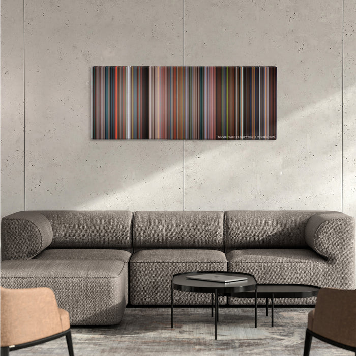 Fantastic Four color palette canvas on a concrete wall above a gray sectional sofa