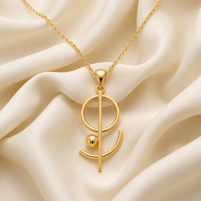 Gold Plated Silver Floating Geometry Necklace with open circle, vertical bar, curved arc, and orb pendant on ivory satin
