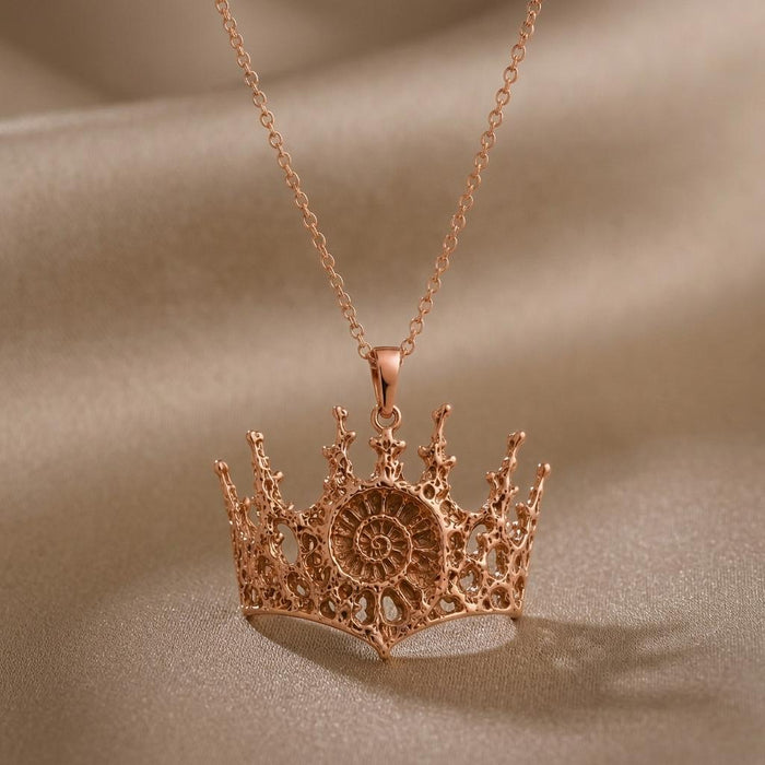 Rose Gold Plated Fossil Crown Necklace with openwork crown cutouts and pointed crown tips on satin
