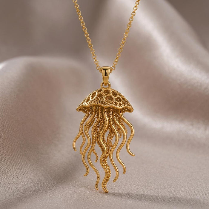 Close product view of a Gold Plated Silver Fossil Jellyfish Halo necklace on champagne satin
