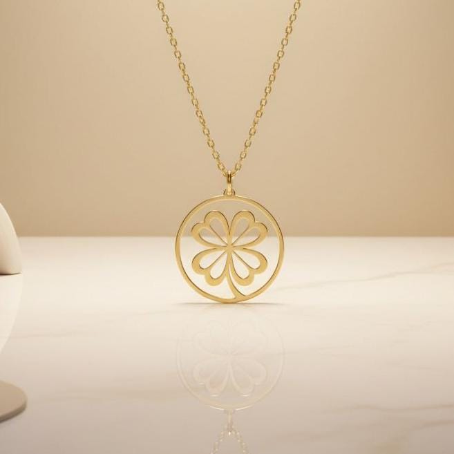 Front product view of a round openwork four-leaf clover pendant on a Gold Plated Silver chain