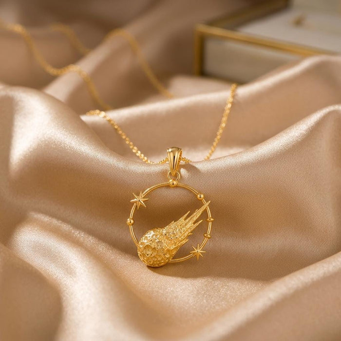 Gold Plated Silver Galactic Meteor Halo pendant with a textured meteor and two star accents on champagne satin