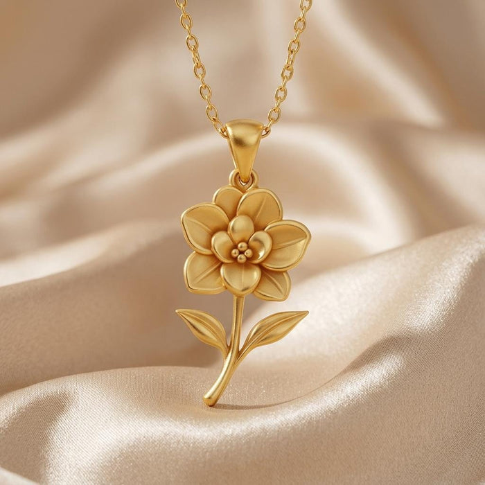 Close-up of the layered Gardenia flower pendant with curved stem and two leaves