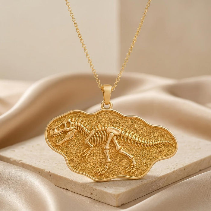 Close-up of Giganotosaurus fossil pendant showing the raised skeleton and textured plaque