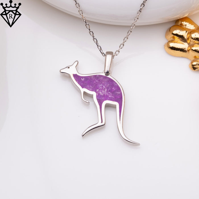 Full product photograph of the purple amethyst kangaroo necklace beneath a white dish on a white display surface