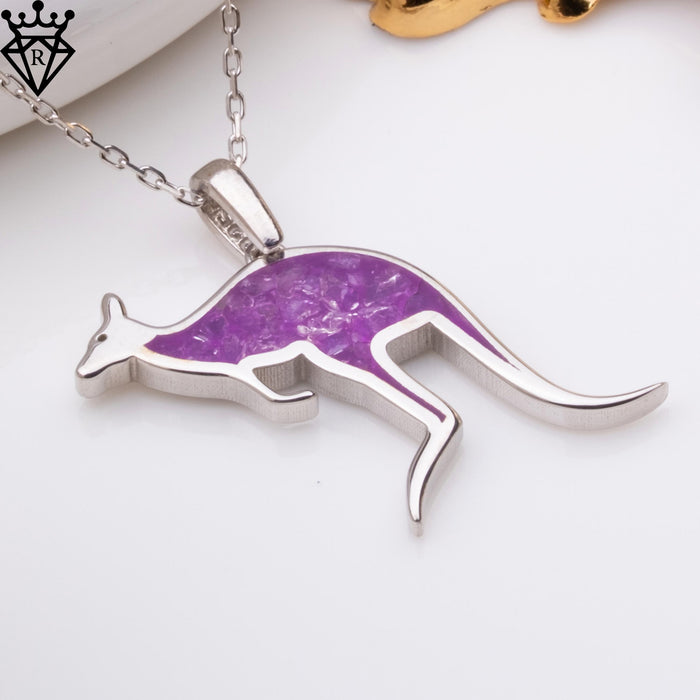 Angled close-up product photograph of the Amethyst Kangaroo pendant showing the purple body detail, raised bail, legs, and curved tail