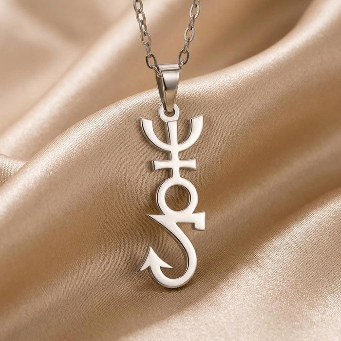 Close-up of the Apophis symbol pendant on champagne-colored satin