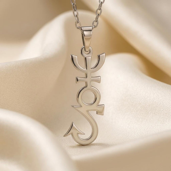 Close-up of the Apophis pendant showing the forked top, crossbar, open circle, and curved lower detail