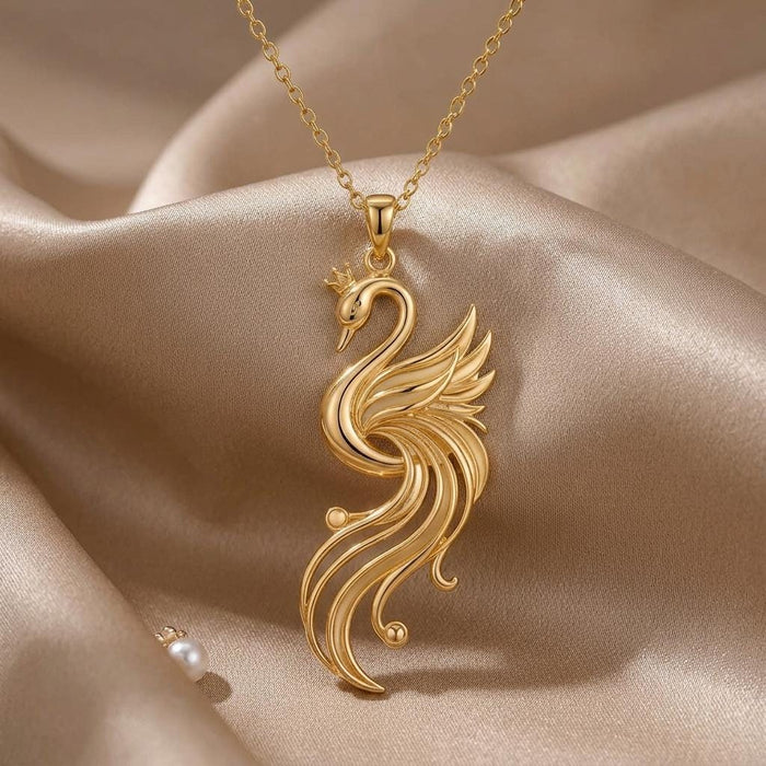 Close product view of the Gold Plated Silver Aurora Swan Pendant on folded champagne satin